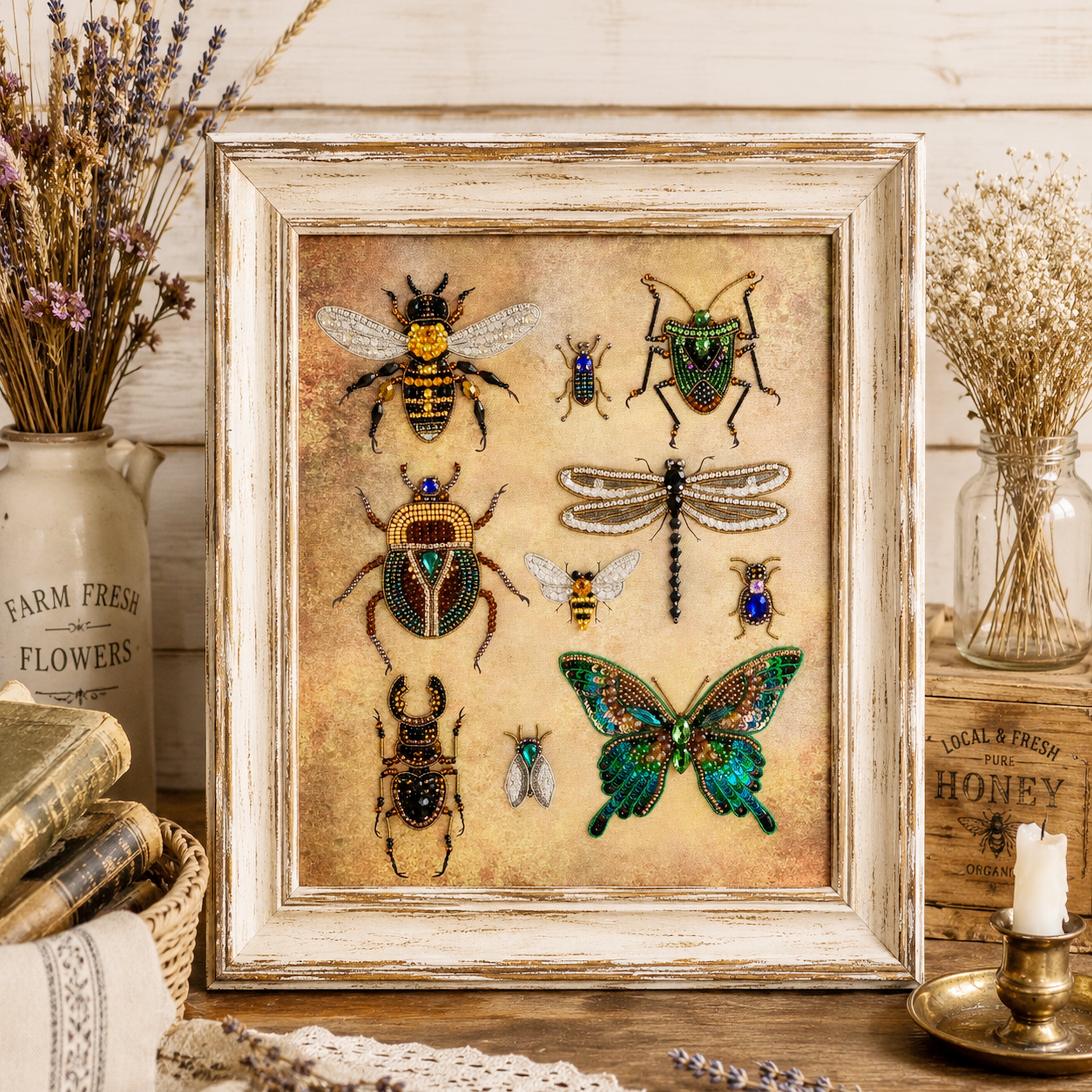 a framed collage of various insects, including bees, butterflies, and dragonflies, set against a rustic wooden background. The insects are intricately detailed and appear to be made of fabric or paper. The frame has a vintage, weathered appearance, adding to the overall aesthetic of the scene.